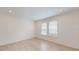 Bright bedroom with neutral walls and wood-look flooring at 1575 Laurel Brook Ln, Port Charlotte, FL 33953