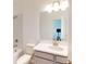 Clean bathroom with a single vanity, shower/tub combo and toilet at 1575 Laurel Brook Ln, Port Charlotte, FL 33953