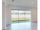 Modern sliding glass doors opening to the backyard at 16113 Old Fox Trl, Port Charlotte, FL 33953