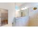 Modern bathroom with a glass shower, tiled walls, and a vanity at 16113 Old Fox Trl, Port Charlotte, FL 33953