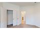 Bright bedroom with double doors leading to a roomy closet and bathroom at 16113 Old Fox Trl, Port Charlotte, FL 33953