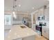 Modern kitchen with gray cabinets, quartz countertops, and an island at 16113 Old Fox Trl, Port Charlotte, FL 33953