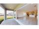 Open floor plan with access to a covered patio and backyard at 16113 Old Fox Trl, Port Charlotte, FL 33953