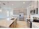 Modern kitchen with gray cabinets, a large island, and stainless steel appliances at 16113 Old Fox Trl, Port Charlotte, FL 33953