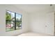 Bright bedroom with neutral walls and carpeting, featuring a large window at 524 Bocelli Dr, North Venice, FL 34275