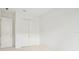 Spacious bedroom with neutral walls, carpeting, and double door closet at 524 Bocelli Dr, North Venice, FL 34275