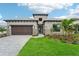 Stunning curb appeal with a stone facade at 524 Bocelli Dr, North Venice, FL 34275