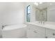 Spa-like bathroom with a freestanding tub, white vanity, and a glass shower at 524 Bocelli Dr, North Venice, FL 34275