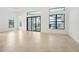 Bright living room with sliding glass doors opening to pool area at 524 Bocelli Dr, North Venice, FL 34275