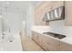 Modern kitchen with blue island and stainless steel appliances at 524 Bocelli Dr, North Venice, FL 34275
