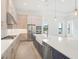 Modern kitchen with blue island and stainless steel appliances at 524 Bocelli Dr, North Venice, FL 34275