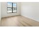 Bright bedroom with hardwood floors and a large window at 524 Bocelli Dr, North Venice, FL 34275