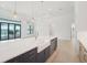 Modern kitchen with island, stainless steel appliances, and white quartz countertops at 524 Bocelli Dr, North Venice, FL 34275