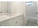 Bright bathroom with white vanity, quartz countertop, and bathtub at 524 Bocelli Dr, North Venice, FL 34275