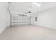 Clean and spacious garage with an automatic door and epoxy flooring at 524 Bocelli Dr, North Venice, FL 34275