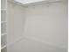 Large walk-in closet with built-in shelves and hanging rod at 524 Bocelli Dr, North Venice, FL 34275