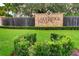 Lakeridge Falls community entrance with stone signage, lush landscaping, and a serene waterfall feature at 8047 Victoria Falls Cir, Sarasota, FL 34243