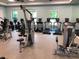 Community gym featuring modern exercise equipment and natural light from several large windows at 8047 Victoria Falls Cir, Sarasota, FL 34243