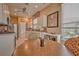 Bright kitchen with white cabinets, modern appliances, and a cozy breakfast nook area at 8047 Victoria Falls Cir, Sarasota, FL 34243