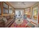 Relaxing living room with comfortable seating, stylish decor, and sliding glass doors to the outdoors at 8047 Victoria Falls Cir, Sarasota, FL 34243