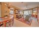 Comfortable living area with dining table, sofa, and views to the lanai at 8047 Victoria Falls Cir, Sarasota, FL 34243