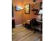 Comfortable home office space with a desk, decor, and wood-look flooring at 8047 Victoria Falls Cir, Sarasota, FL 34243