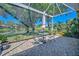 Relaxing screened-in patio with outdoor seating and scenic views of the lake at 8047 Victoria Falls Cir, Sarasota, FL 34243