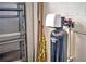 Water softener filtration system in basement near garage door at 8047 Victoria Falls Cir, Sarasota, FL 34243