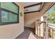 Private balcony with a view of the lush landscaping at 370 Three Lakes Ln # F, Venice, FL 34285