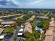 Aerial view of condo community with pool and pond at 370 Three Lakes Ln # F, Venice, FL 34285