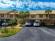Condo building with covered parking spaces at 370 Three Lakes Ln # F, Venice, FL 34285