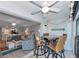 Relaxing screened balcony with table and chairs, offering peaceful water views at 370 Three Lakes Ln # F, Venice, FL 34285