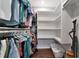 Spacious walk-in closet with shelving and hanging rods at 370 Three Lakes Ln # F, Venice, FL 34285