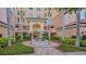 Attractive building exterior with a central fountain and landscaping at 401 N Point Rd # 301, Osprey, FL 34229