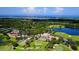 Aerial view of The Oaks Club community, highlighting the golf course and surrounding landscape at 401 N Point Rd # 301, Osprey, FL 34229