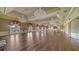 Large ballroom with hardwood floors and elegant chandeliers at 401 N Point Rd # 301, Osprey, FL 34229