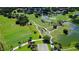 Aerial view of a lush green golf course with ponds at 401 N Point Rd # 301, Osprey, FL 34229