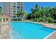 Resort-style pool with a spa and lounge area at 401 N Point Rd # 301, Osprey, FL 34229