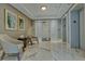 Lobby with comfortable seating, marble floors, and elevator access at 401 N Point Rd # 301, Osprey, FL 34229