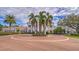 Impressive clubhouse entrance with circular driveway at 401 N Point Rd # 301, Osprey, FL 34229