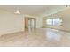 Bright living room with tile floor and access to kitchen at 5372 Pamela Wood Way # 7, Sarasota, FL 34233