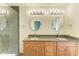 Double vanity bathroom with granite countertops and a shower at 5372 Pamela Wood Way # 7, Sarasota, FL 34233