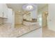 Granite countertop kitchen with white cabinets and breakfast bar at 5372 Pamela Wood Way # 7, Sarasota, FL 34233