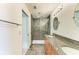 Spa-like bathroom with walk-in shower and granite vanity at 5372 Pamela Wood Way # 7, Sarasota, FL 34233