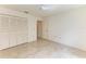 Spacious bedroom with tiled floors and large closet at 5372 Pamela Wood Way # 7, Sarasota, FL 34233