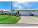 Front view of charming villa with double garage at 5372 Pamela Wood Way # 7, Sarasota, FL 34233