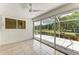 Spacious Florida room with sliding glass doors and a view at 5372 Pamela Wood Way # 7, Sarasota, FL 34233