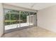 Bright Florida room with sliding doors leading to a patio at 5372 Pamela Wood Way # 7, Sarasota, FL 34233