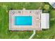 Community pool with surrounding patio furniture at 5372 Pamela Wood Way # 7, Sarasota, FL 34233