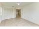 Bright bedroom with tiled floors and ceiling fan at 5372 Pamela Wood Way # 7, Sarasota, FL 34233